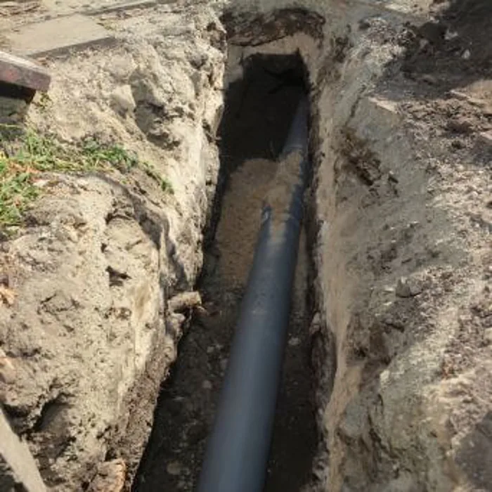 Excavated drain line prepared for repair and relining